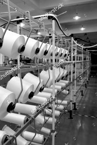 stock-photo-textile-industry-yarn-spools-on-spinning-machine-in-a-textile-factory-137598179